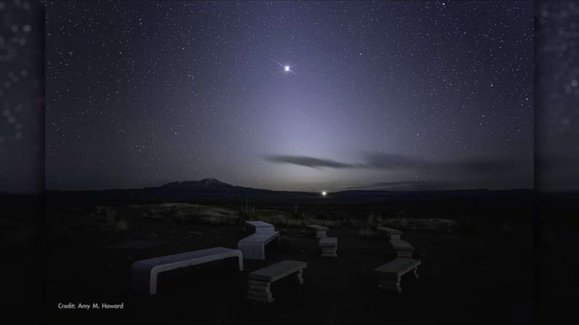 The ghostly zodiacal light stretches upward from the horizon