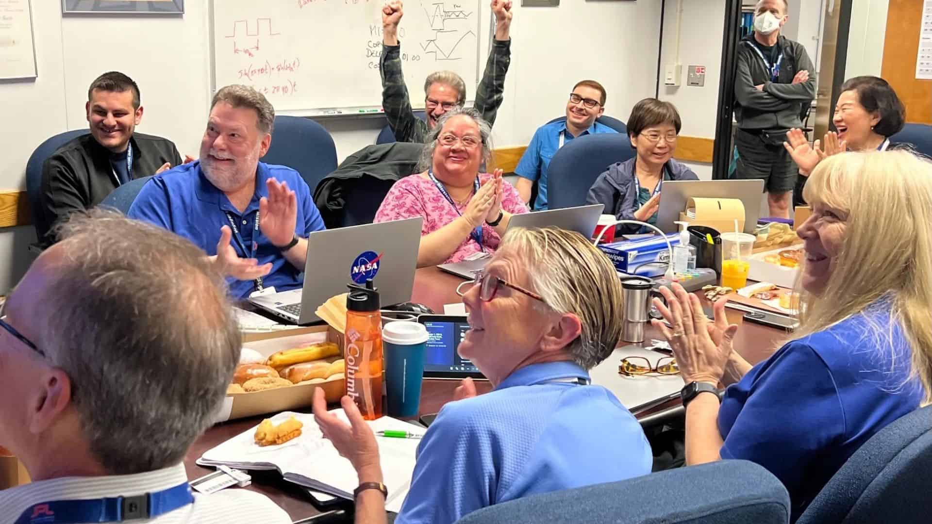 The Voyager 1 team celebrates in a conference room at NASA’s Jet Propulsion Laboratory on April 20, after receiving data about the health and status of Voyager 1 for the first time in five months